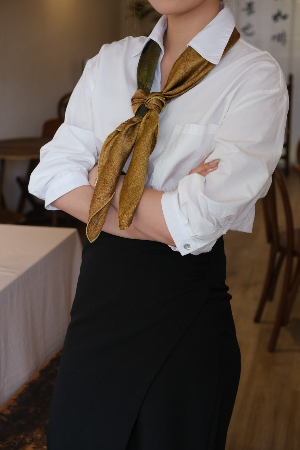 Elegant woman wearing silk scarf styling