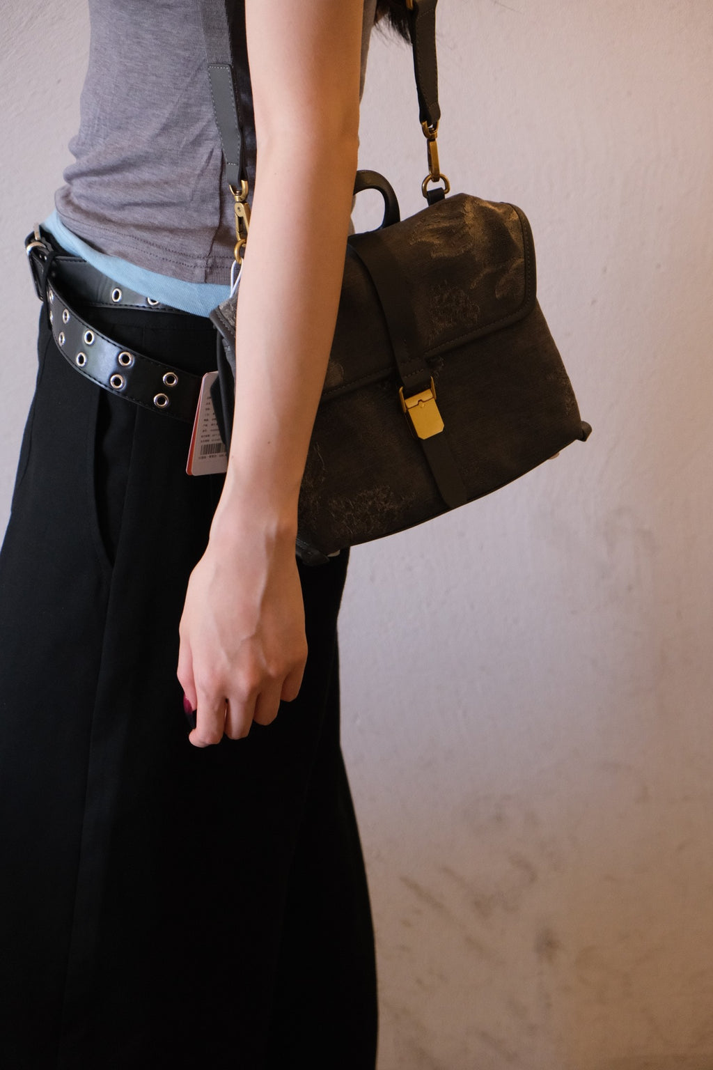 Lifestyle still‑life shot on wood, quiet‑luxury oriental floral handbag