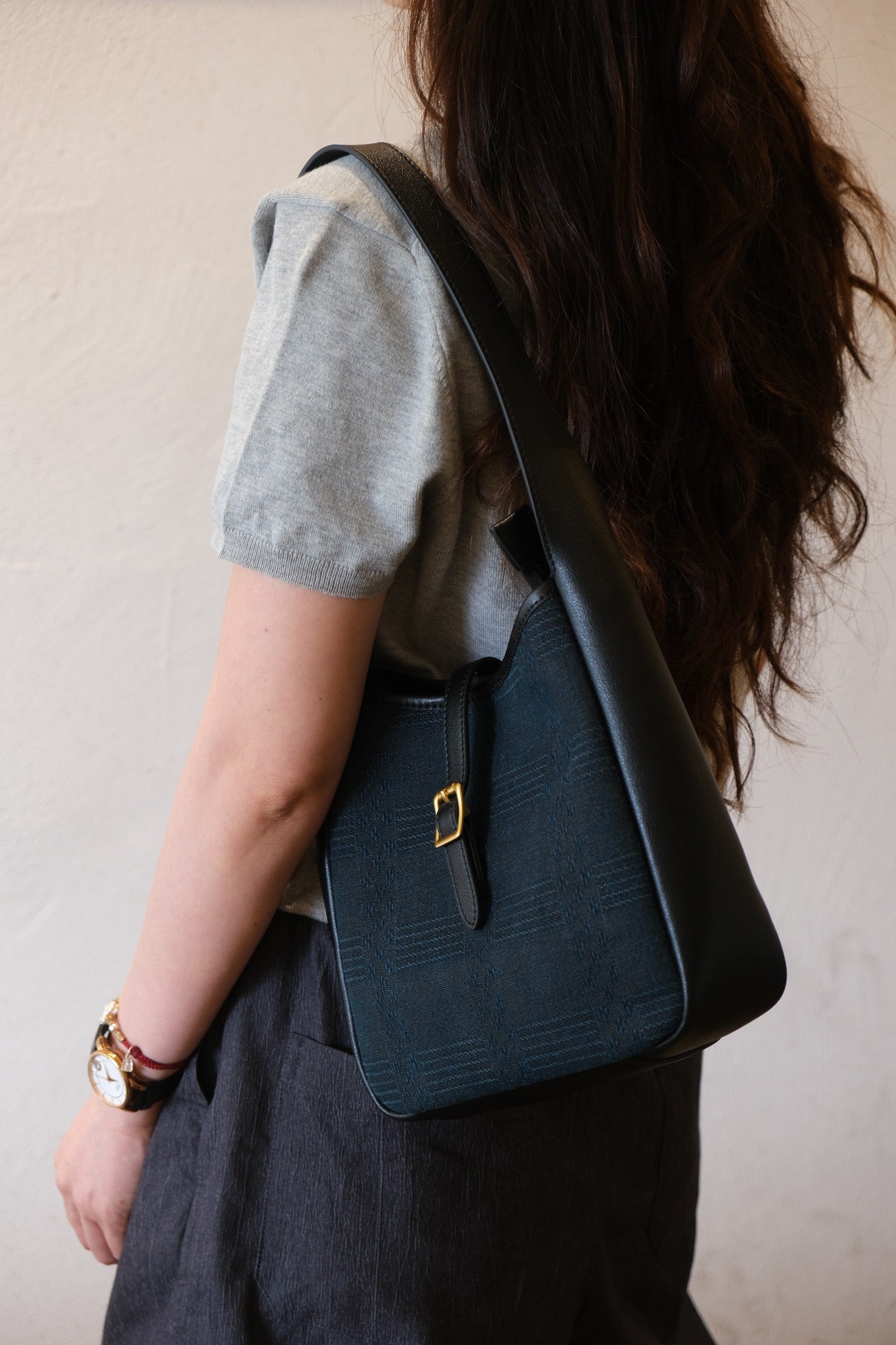 Top‑down flat lay view of Xiangyunsha cowhide hobo bag